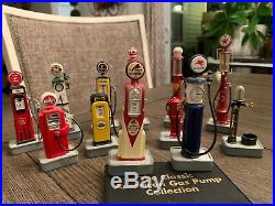 12 Cast Metal Miniature Gas Pumps With The American Gas Pump Collection Booklet